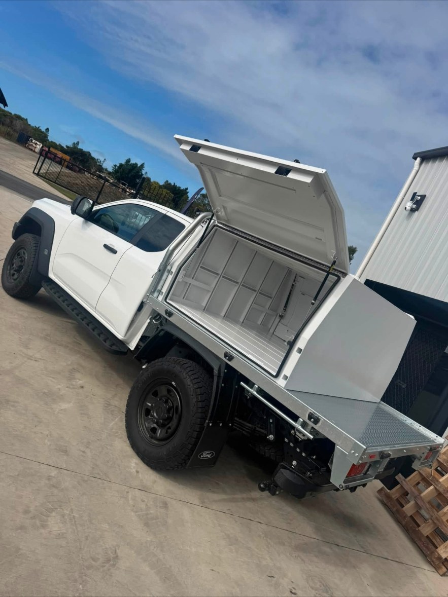 Ute fitted with a galvanised tray and canopy, lids open